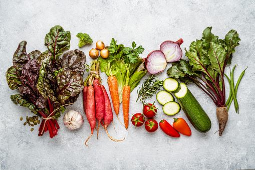 Overhead view of fresh healthy organic vegetables background. High resolution 42Mp studio digital capture taken with SONY A7rII and Zeiss Batis 40mm F2.0 CF lens