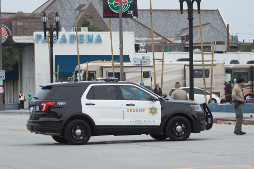 Pasadena, California, United States: Sheriff vehicle shown blocking traffic on Colorado Boulevard for street cleaning following the Rose Parade.