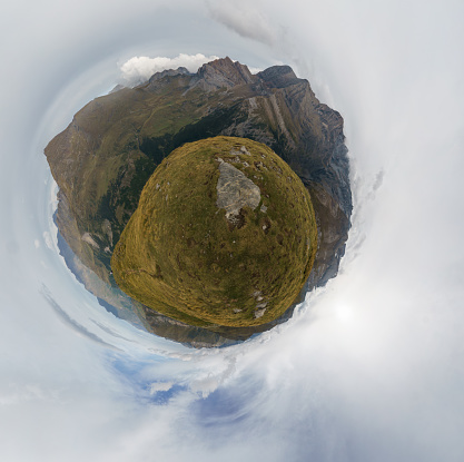 Abstract little planet 360 degree panorama of beautiful mountain landscape near Gavarnie with taillon peak, Pyrenees, Nouvelle-Aquitaine, France
