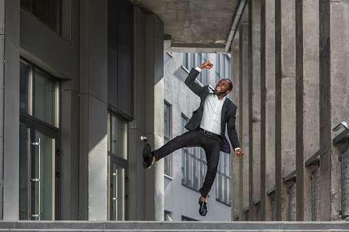 Successful businessman concept, mature african american man outside office building