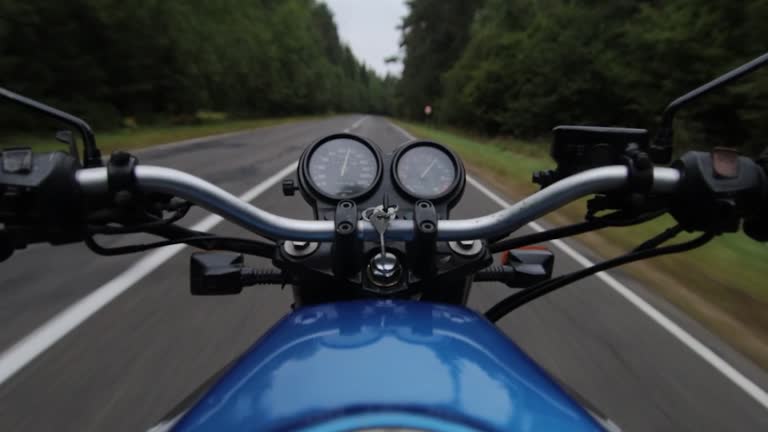 motorbike riding on forest road, first person motorcyclist journey.