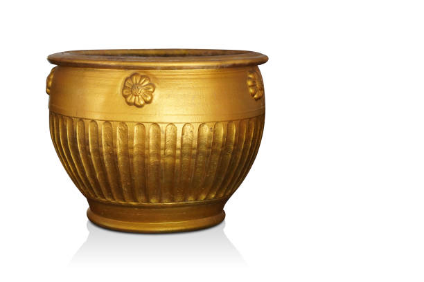 istock gold pottery pot on white background, vintage, retro, antique, old, decor, copy space 1456420475
