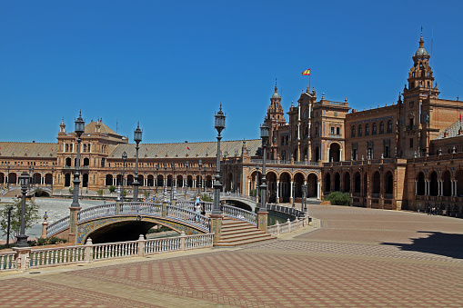 The Plaza de España is an architectural complex located in the María Luisa park in the city of Seville. It was designed by the architect Aníbal González. It was built between 1914 and 1929 as one of the main constructions of the Ibero-American Exhibition of 1929.