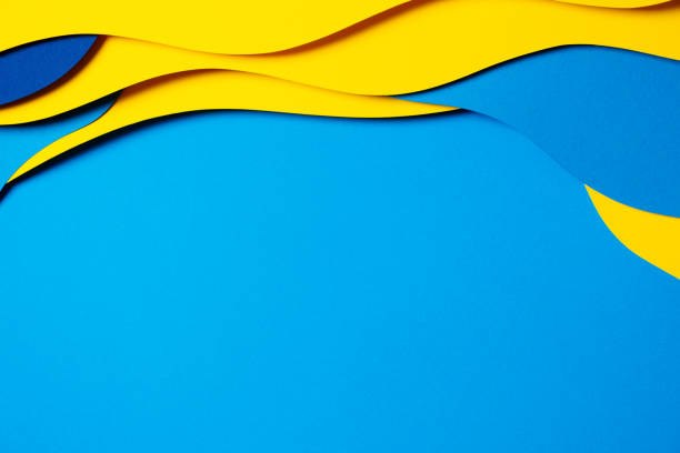 istock Abstract colored paper texture background. Minimal paper cut composition with layers of geometric shapes and lines in light blue, navy blue, yellow colors 1456425333