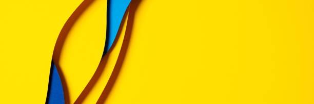 istock Abstract colored paper texture background. Minimal paper cut composition with layers of geometric shapes and lines in light blue, navy blue, yellow colors 1456425361