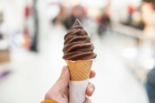 istock Caucasian guy holding chocolate ice cream 1456425970