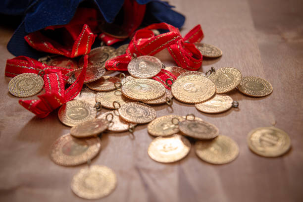 Turkish gold coins on wooden background.