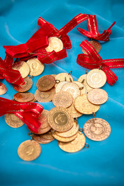 istock Turkish gold coins on wooden background. 1456426469
