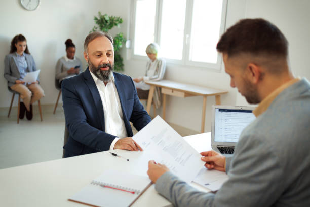 istock Well dressed mature man having job interview at the office 1456429233