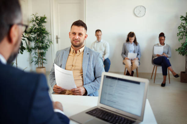 istock Young well dressed man having job interview at the office 1456429247