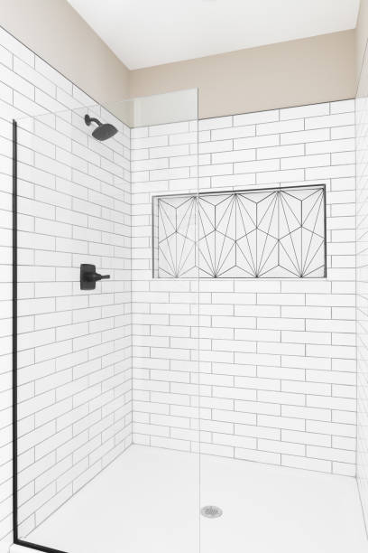 istock A shower with white subway tiles and kavala pattern shelf. 1456429421