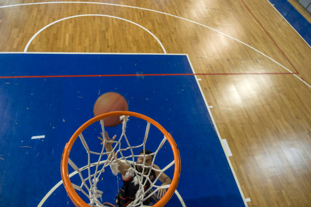 istock Man in wheelchair practicing basketball 1456429547