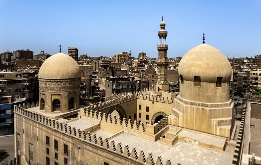 Cairo, Egypt, April 16, 2022: Aerial view of the Madrassa of Amir Sarghitmish built in 1356. It is situated in the northeast of the Mosque of Ibn Tulun, in Islamic Cairo.