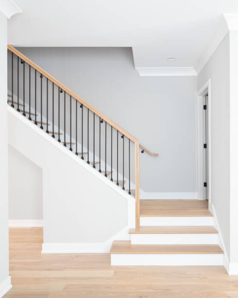 istock A stairs with light wood and wrought iron spindles. 1456430193