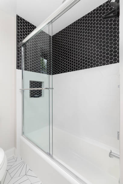 istock A shower with black and white hexagon tiles. 1456430198