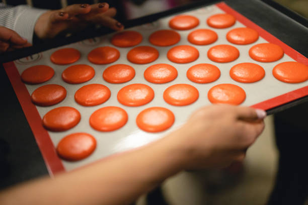 istock the cook is baking macaroon cookies 1456437436