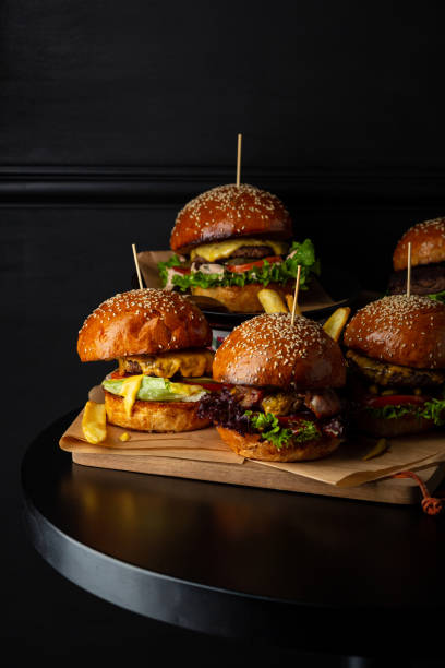 istock Close up of  burger with different meats and sauces black copy space 1456437746