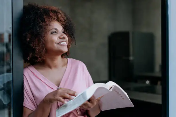 Photo of Woman reading the bible