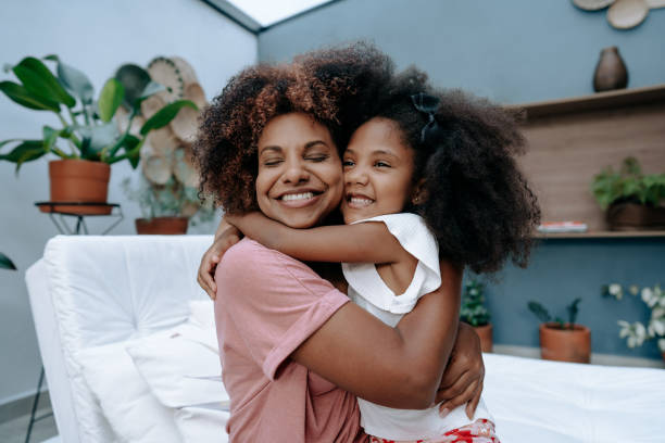 母と娘の母の日 - child offspring women posing ストックフォトと画像