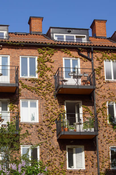 istock Low angle view of residential building against clear blue sky 1456438716
