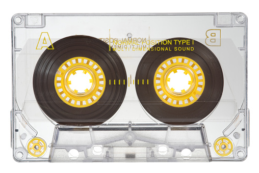 Transparent audio cassette on white