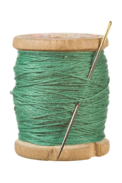 Green sewing Vintage wooden reel of thread on white wooden spool stock pictures, royalty-free photos & images