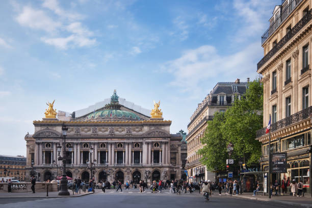 Front view of the famous Garnier Palace or Opera Garnier from avenue, at the Opera Square in the 9th arrondissement Paris, France - May, 2022: Front view of the famous Garnier Palace or Opera Garnier from avenue, at the Opera Square in the 9th arrondissement place de lopera stock pictures, royalty-free photos & images