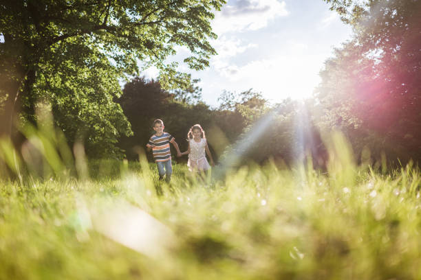 istock Beautiful children running in nature 1456447253