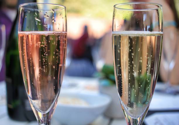 istock Two Champagne Glasses Filled with Bubbly 1456452736