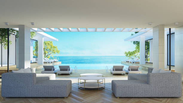 spiaggia soggiorno di lusso e mare 

visualizza interni - rendering 3d - santorini greece villa beach foto e immagini stock