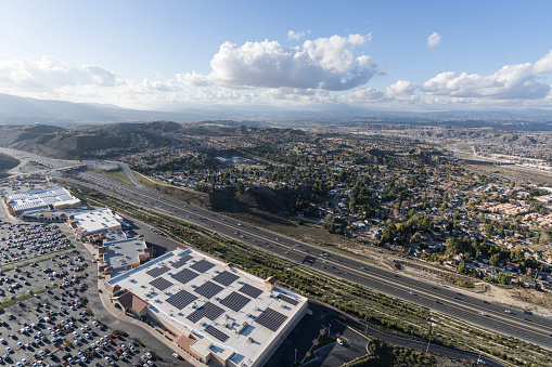 Aerial view of bog box stores and the 14 freeway in the Santa Clarita community of Los Angeles County, California.