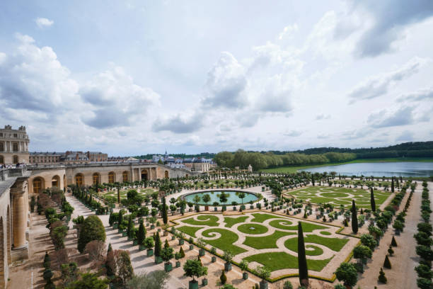 Gardens of the famous Palace of Versailles. whole site have unique fountains, ponds, lake and landscapes built in 17th c. Paris, France - May, 2022:  Gardens of the famous Palace of Versailles. whole site have unique fountains, ponds, lake and landscapes built in 17th c. berk stock pictures, royalty-free photos & images