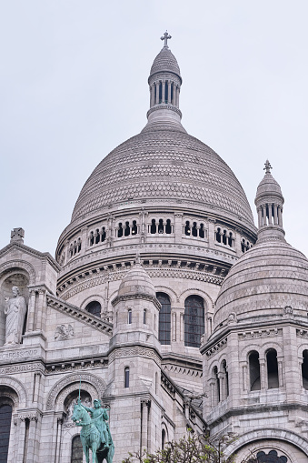 Paris, France - May 18, 2022: Basilica of Sacre Coeur (Sacred Heart) on Montmartre hill