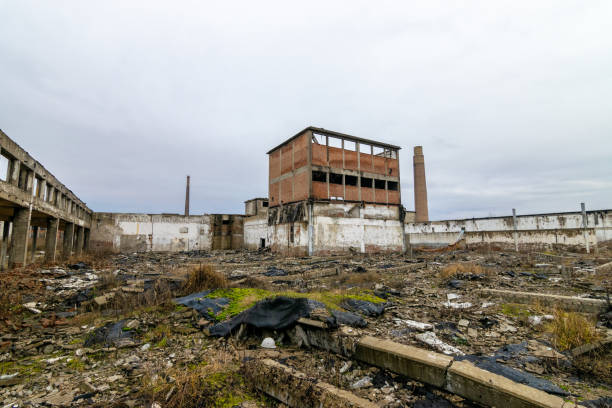 Inside of an old chemical factory looted dilapidated crumbling. Murky weather stock photo