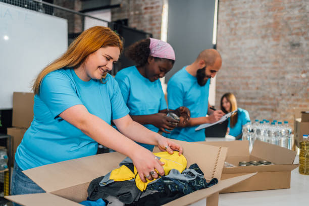 istock Diverse volunteers team packing donation boxes 1456460186