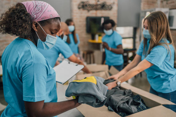 istock Young team of volunteers working together 1456461124