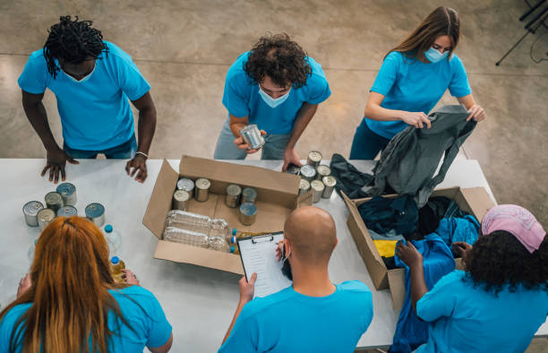 istock Young team of volunteers working together 1456461183