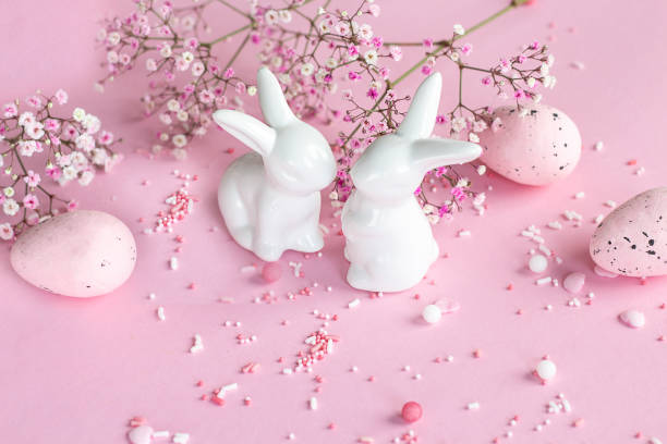 istock Easter background. Easter bunnies on a pink background. happy easter card. Easter. Flowers 1456461511