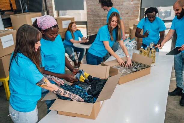 istock Diverse volunteers team packing donation boxes 1456462119