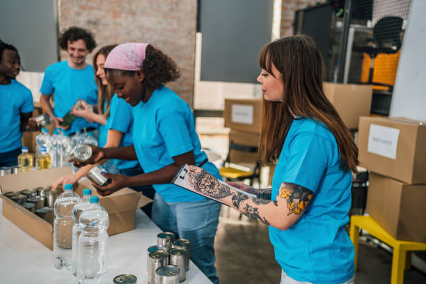 istock Diverse volunteers team packing donation boxes 1456462154