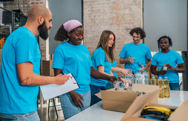 istock Diverse volunteers team packing donation boxes 1456462402