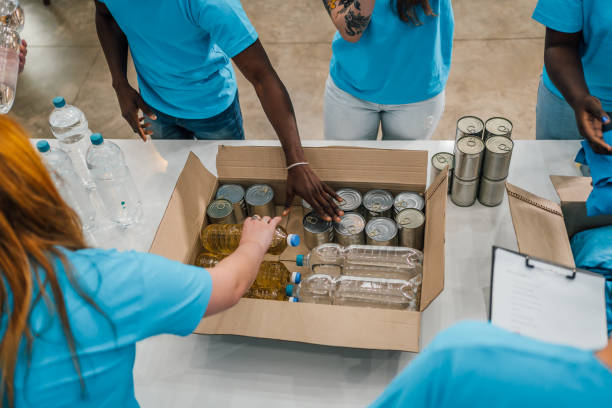 istock Volunteers in charity donations center 1456463628