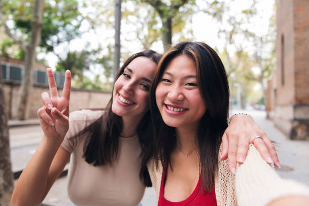 istock women smiling happy and having fun while they date 1456467161