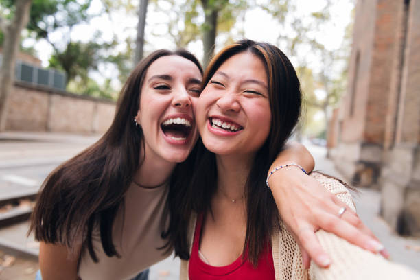 istock women laughing and having fun while dating 1456467169