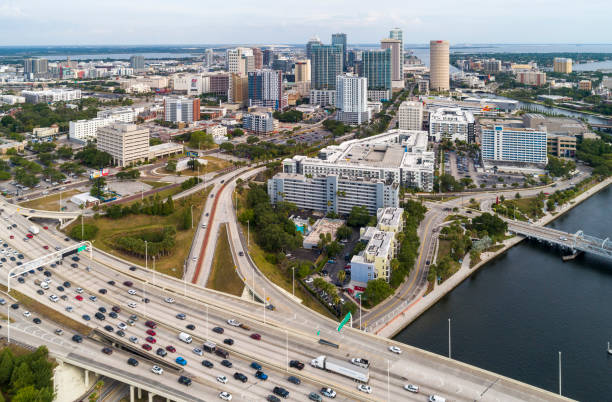 Aerial skyline of Tampa, Florida. Distant view of Downtown Tampa over the Hillsborough River and big transport junction. stock photo