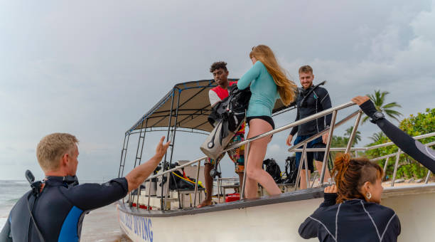 istock A diving team loading a boat on the Indian Ocean shore, loading it preparing for an expedition. 1456468619