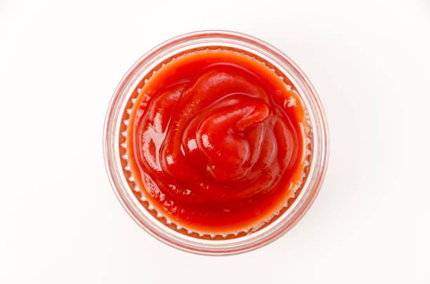 istock tomato ketchup in a small glass bowl on a white background 1456468627