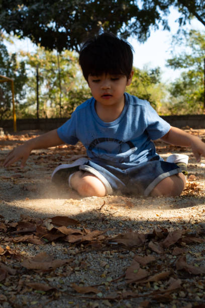 istock Hispanic toddler playing in a playground in the morning 1456468692