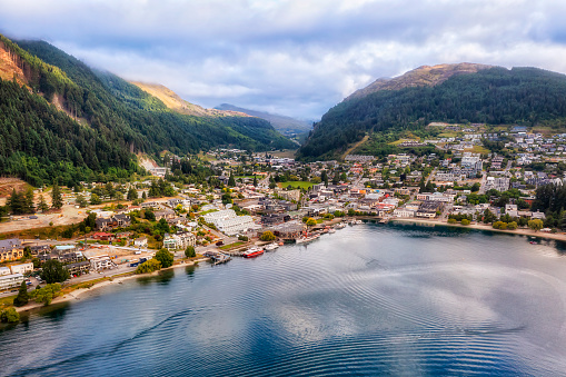 Downtown waterfront of Queenstown on Lake Wakatipu in New Zealand - aerial cityscape.