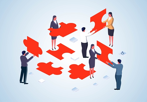 Build new teams to develop new business, business team growth and development, team camaraderie teamwork to achieve success.Isometric group of businessmen together to put together a puzzle